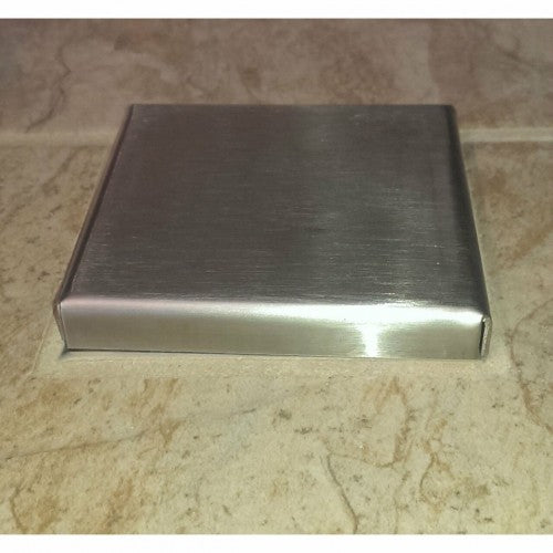 Bull Umbrella Hole Plus Stainless Steel - 16625 - Cover Placed Over a Tiled Surface.