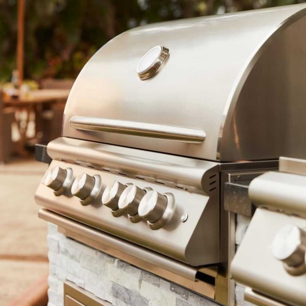 Blaze BLZ-4LTE3-LP Premium LTE+ 32-Inch 4-Burner Built-In Propane Grill With Rear Infrared Burner & Lift-Assist Hood - Angled View - Lifestyle