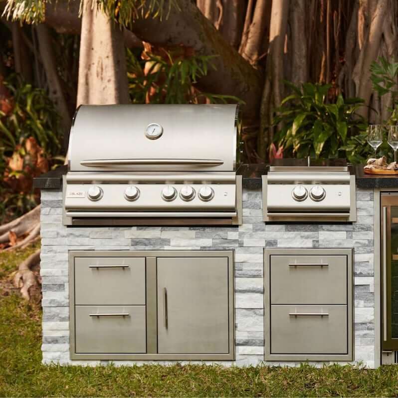 Blaze BLZ-4LTE3-LP Premium LTE+ 32-Inch 4-Burner Built-In Propane Grill With Rear Infrared Burner & Lift-Assist Hood - Front View - Lifestyle