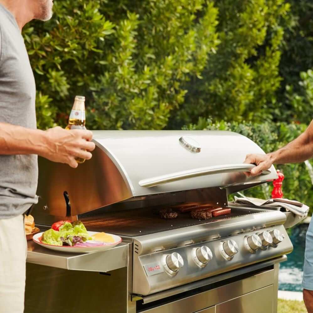 Blaze BLZ-5LTE3 Premium LTE+ 40-Inch 5-Burner Gas Grill With Rear Infrared Burner & Lift-Assist Hood - Men Chatting By Grill - Lifestyle