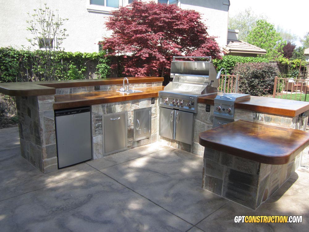 Sunstone 14x20 & 17x24 Vertical Access Door Vented w/Left or Right Swing - A-DV1724 - Outdoor kitchen with stainless steel appliances and vented doors.