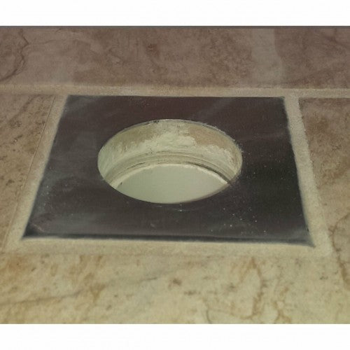 Bull Umbrella Hole Plus Stainless Steel - 16625 - Square Cover Installed Over a Round Hole in Tile.