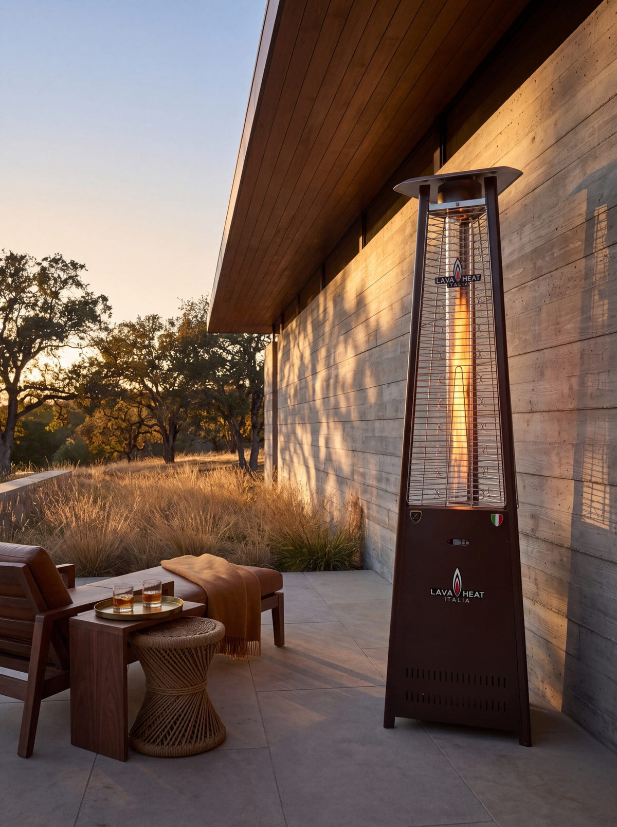 Lava Heat Italia 2G Flame Tower patio heater in Heritage Bronze – outdoor setting