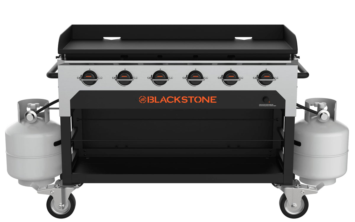 Blackstone 48-inch catering griddle, front view with two propane tanks mounted