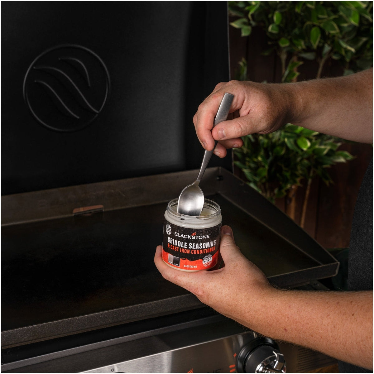Blackstone griddle seasoning and cast iron conditioner, applying to a griddle top