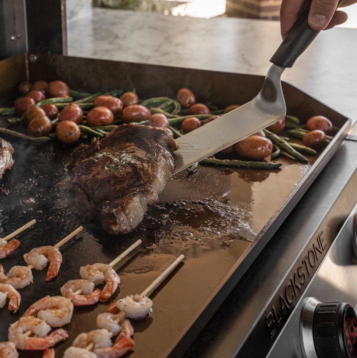 Blackstone 30-inch electric built-in griddle, food on the griddle plate