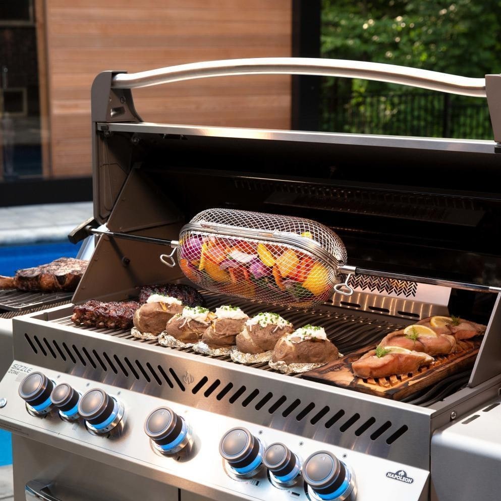 Napoleon Prestige 665 Grill with Infrared Rear Burner and Infrared Side Burner - P665RSIBSS (2019) - Lifestyle View with Optional Rotisserie Basket