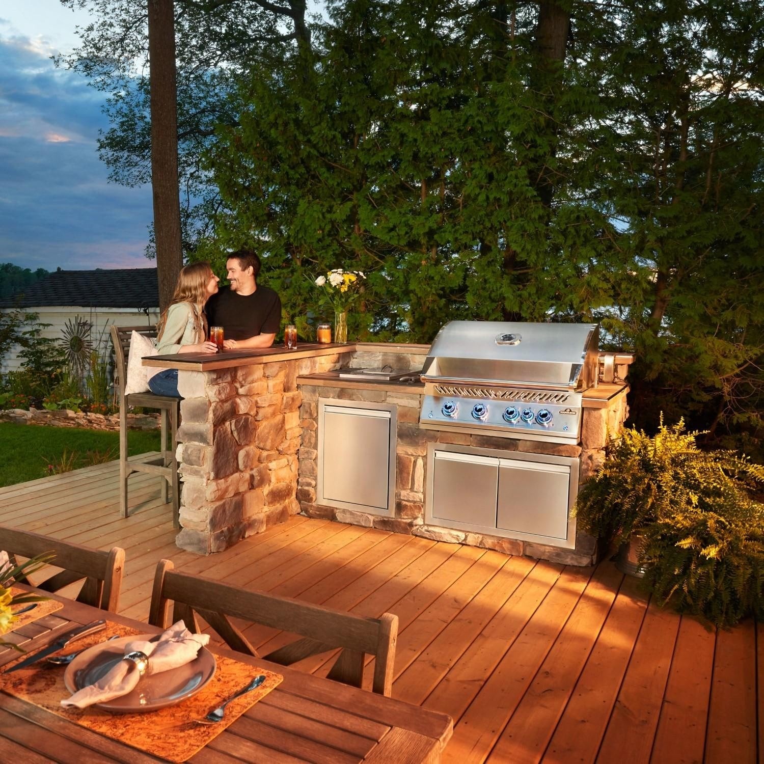 Napoleon BIG32RBSS-1 Grill - Couple Sitting at Bar by Built-In Grill - Lifestyle