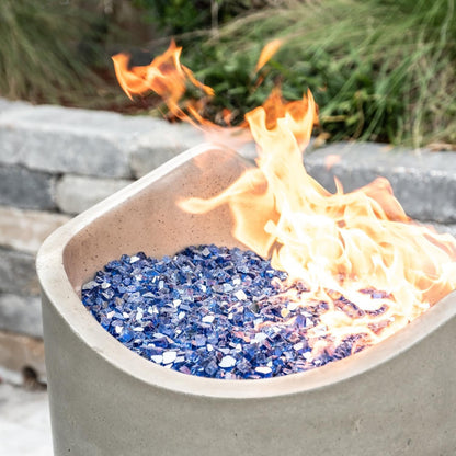 American Fyre Designs Wave 20-inch  Fire Urn - Smoke - Lifestyle - Shown with Alpine Flame Sky Blue Fire Glass (Sold Separately)