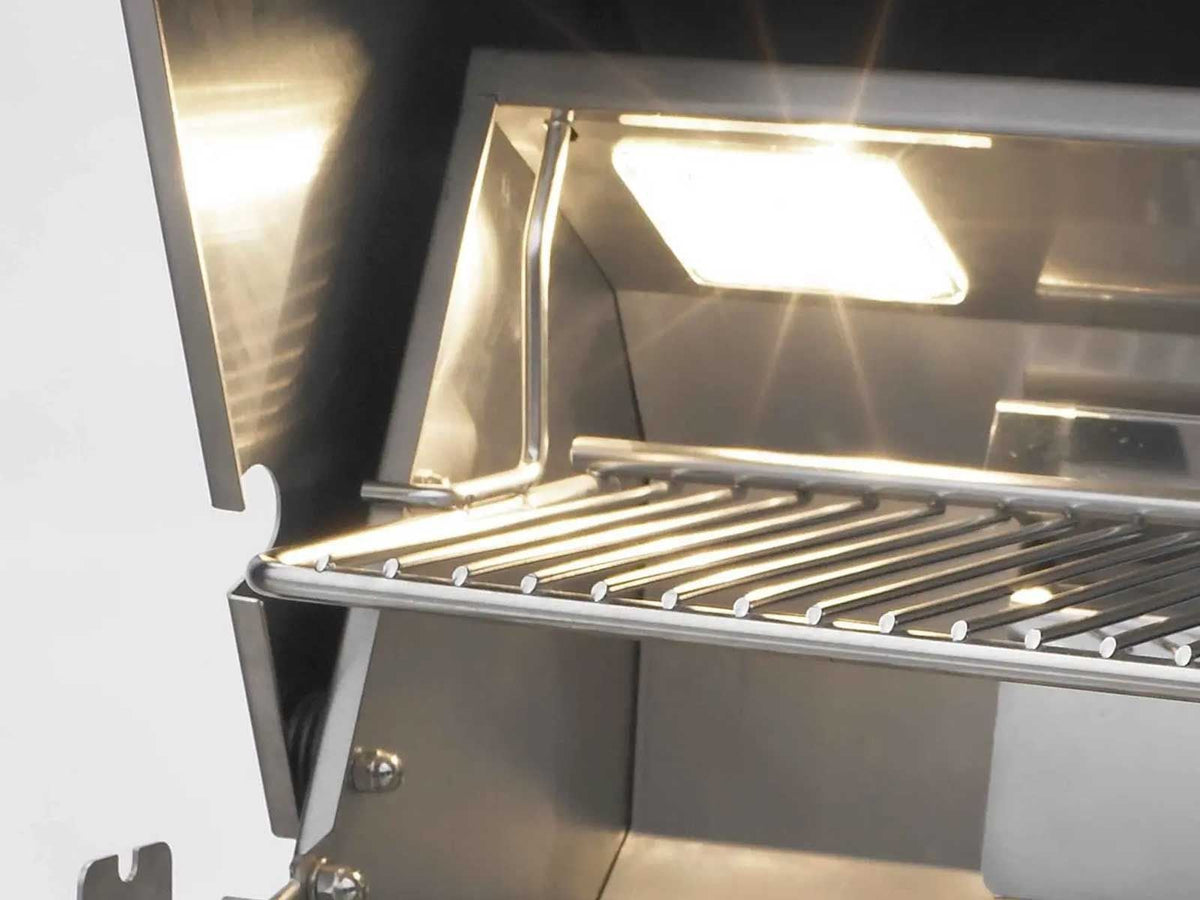 Interior hood light and warming rack inside the open Fire Magic Echelon E1060i